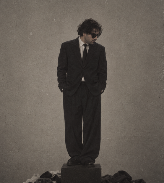 Reference for Brandon portrait in a loose suit on a pedestal
